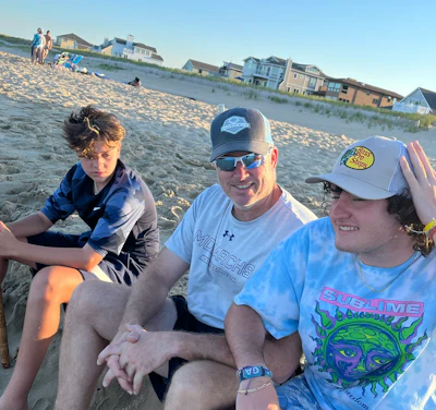 Kevin and his sons, Nolan (left), and Aaron (right), at the beach when they were younger.