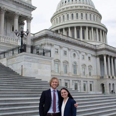 Austin Swisher, MD, and Emily Youner, MD, on the steps of the Capitol for the 2026 Congressional Advocacy Day.